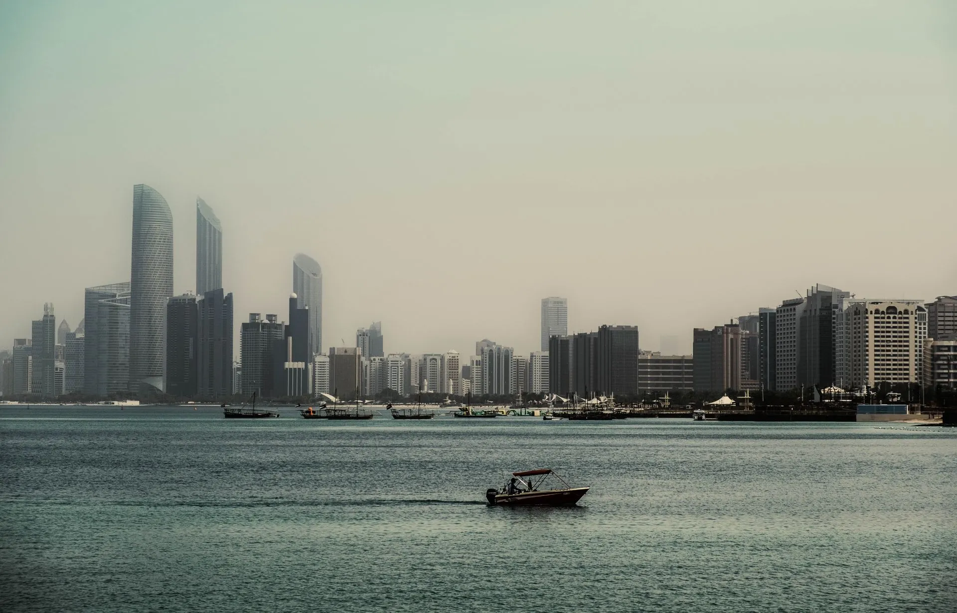 Abu Dhabi skyline and boats along the waterfront